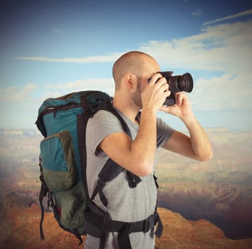 Explorer photographing landscapes visited with his camera