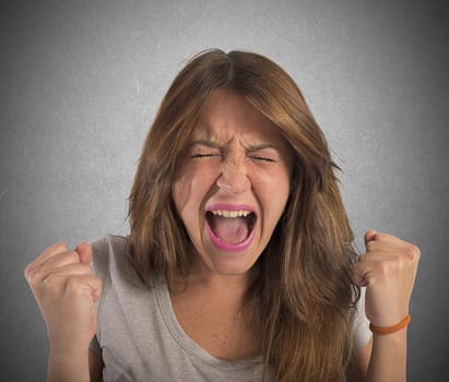 Aggressive businesswoman stressed out from work screams