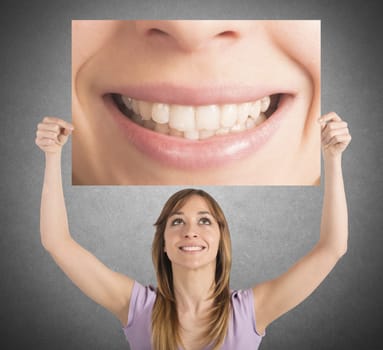 Girl shows her smile in a billboard