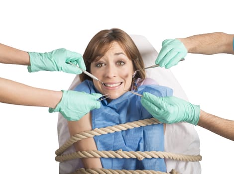 Girl tied to a chair at dentist