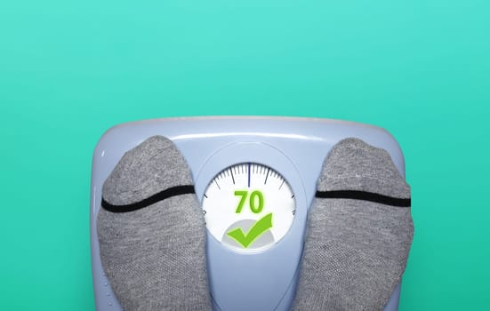 Person check his weight with a balance