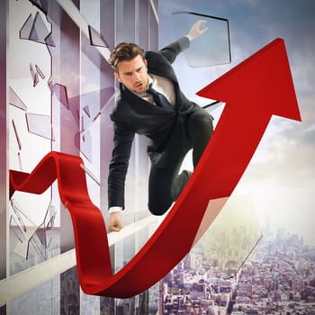 Determined businessman over a big red arrow