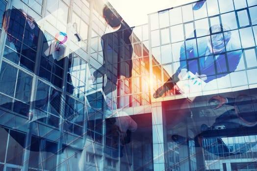 Team of people works together on company statistics in office. Shooted from above. Concept of teamwork and partnership. double exposure