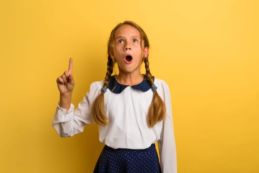 Young student is with shocked expression and indicates something