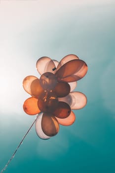 Colorful balloons on blue sky -  retro instagram effect.Concept of love in summer, valentine, wedding and honeymoon.