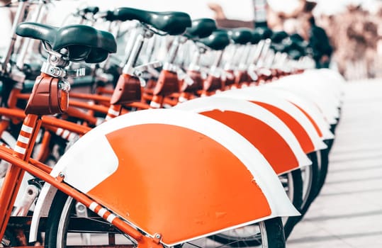 Row of red bicycles in the city