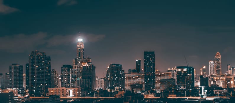 Bangkok, Thailand - 14 Juny 2019: Panoramic landscape scenery of buildings and skycrapers in the central business area of Bangkok city at night