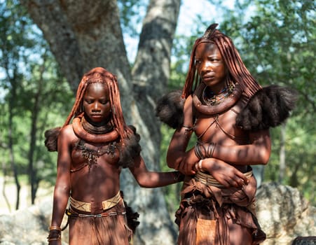 NAMIBIA, OMUSATI REGION, MAY 7: Portrait of two Himba woman with traditional hairstyle and necklaces around her neck. The Himba are indigenous namibian ethnic people, in northern Namibia, May 7, 2018, Namibia