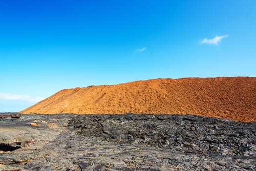 Barren black and red landscape of Santiago Island in the Galapagos Islands in Ecuador