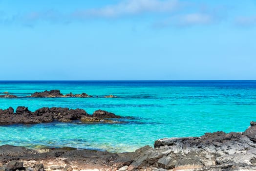 Blue and turquoise water of Santiago Island in the Galapagos Islands in Ecuador