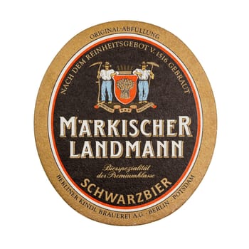 BERLIN, GERMANY - MARCH 15, 2015: Beermat of German beer Maerkischer Landmann isolated over white background