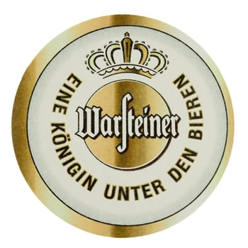 BERLIN, GERMANY - MARCH 15, 2015: Beermat of German beer Warsteiner isolated over white background