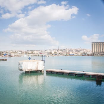 Landing at the pier in Cagliari harbor .