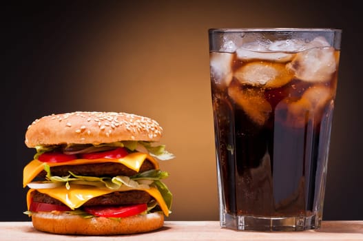 an American burguer with chips and coke