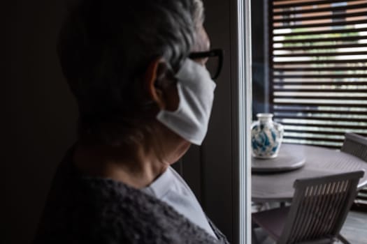 The coronavirus epidemic is a growing concern for older people because they are the population more at risk of mortality. Human face deliberately defocused. Concept of worry and isolation.
