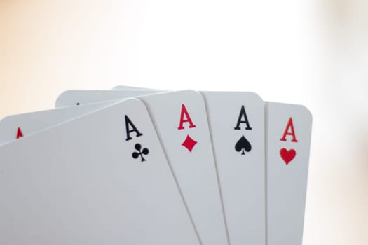 Young man is playing cards, cutout of his hands