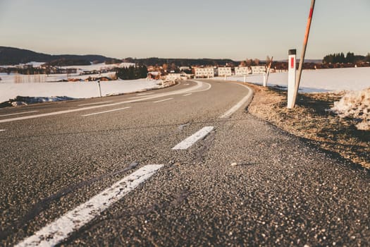 Black rough asphalt road in Austria, closeup