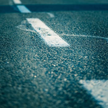 Black rough asphalt road in Austria, closeup