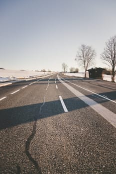 Black rough asphalt road in Austria, closeup