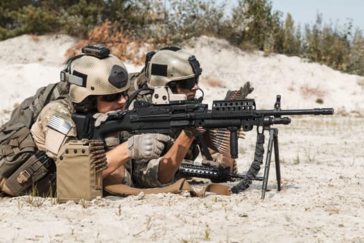 Members of US Army Rangers machinegun crew during the fight in the desert
