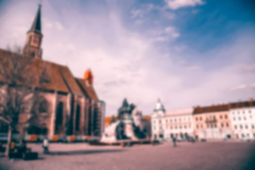Blurred city background with people on terraces or restaurants