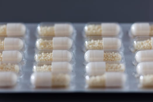 Pills / medicine lying on the grey table, flu season