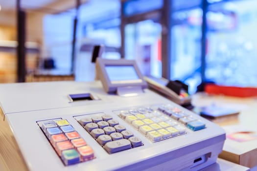 Cash register in a shop: Customer is paying purchase