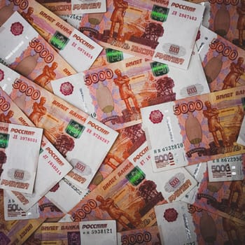 Rubles background. Russian money banknotes of five thousand rubles, scattered all over the surface. Layout, mockup.