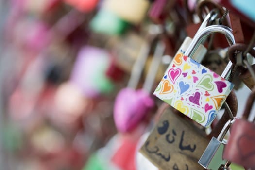 Colourful cute love locks on Markartsteg, Salzburg  Copy space and blurryness