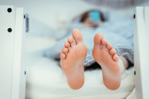 Girl with Barenaked feed is lying in her bunk bed, morning