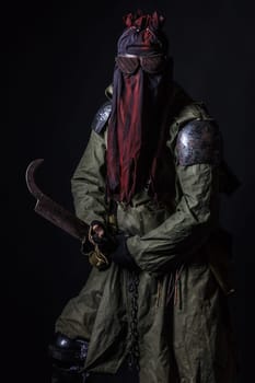 Nuclear post apocalypse. Studio shot of survivor in tatters
