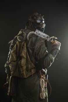 Nuclear post apocalypse. Studio shot of survivor in tatters