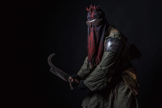 Nuclear post apocalypse. Studio shot of survivor in tatters