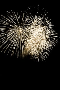 Premium entertainment magic star firework at e.g. New Years Eve or Independence Day party celebration. Black dark night background.