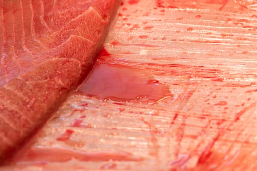 Traditional healthy sea food from seafood market with stripes pattern at butcher. Quality food for sushi lunch or fine gourmet dinner.