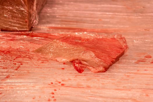 Traditional healthy sea food from seafood market with stripes pattern at butcher. Quality food for sushi lunch or fine gourmet dinner.