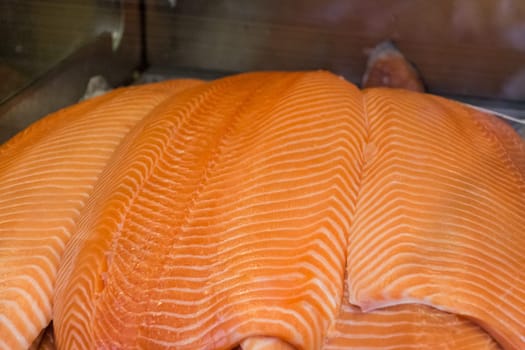 Traditional healthy sea food from seafood market with orange white stripes pattern. Quality food for sushi lunch or barbecue dinner.