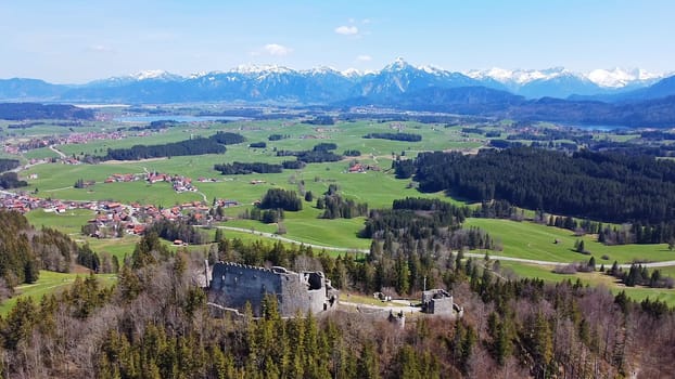 Aerial photo with drone of Eisenberg castle ruin in Allgäu with Allgäu Alps (Bavaria, Germany)