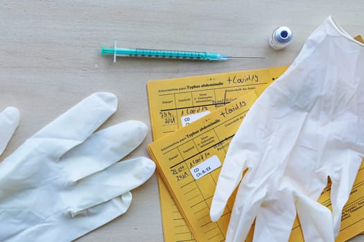 Corona Covid-19 Vaccination with Vaccination Card, Vaccination Bottle, Syringe and Gloves