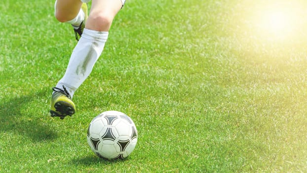 Football Player Compete For a Ball. Children Playing Sports on Grass Pitch. Closeup Image of Youth Football Competition Match. detail photo