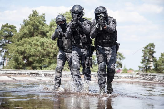 Spec ops police officers SWAT in action in the water