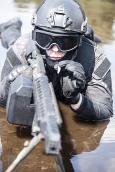 Spec ops police officer SWAT in action in the water