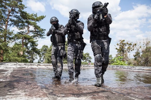 Spec ops police officers SWAT in action in the water
