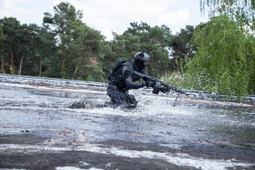 Spec ops police officer SWAT in action in the water
