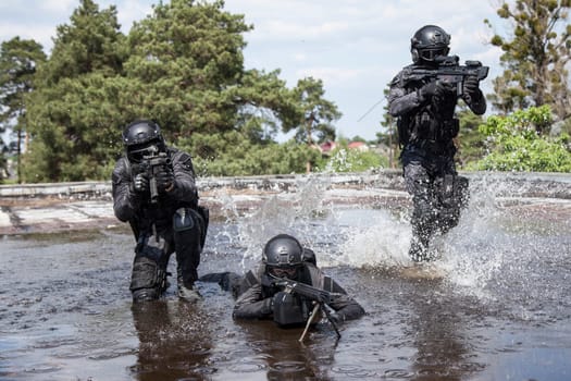 Spec ops police officers SWAT in action in the water