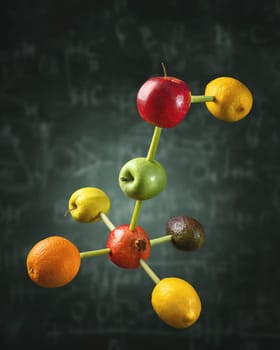 Connected fruits in the shape of molecular structure chain. Concept for vitamins diet or healthy natural food formula.