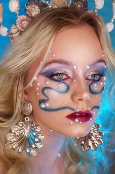 young woman with makeup and pearl jewellery
