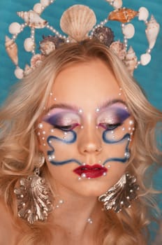 young woman with makeup and pearl jewellery