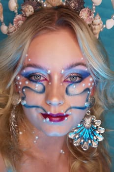 young woman with makeup and pearl jewellery