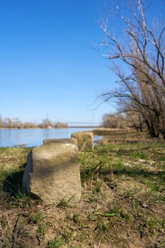 Stone on the bank of the river Elbe on the Elbe cycle path near Magdeburg in Germany